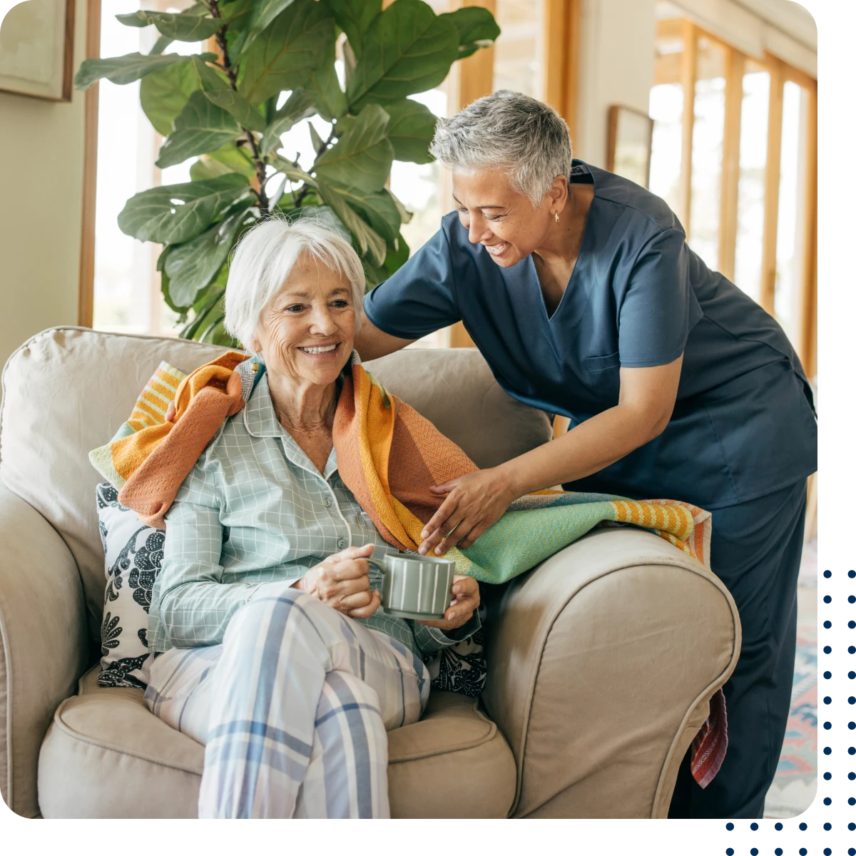 Elderly woman and caregiver sharing a moment