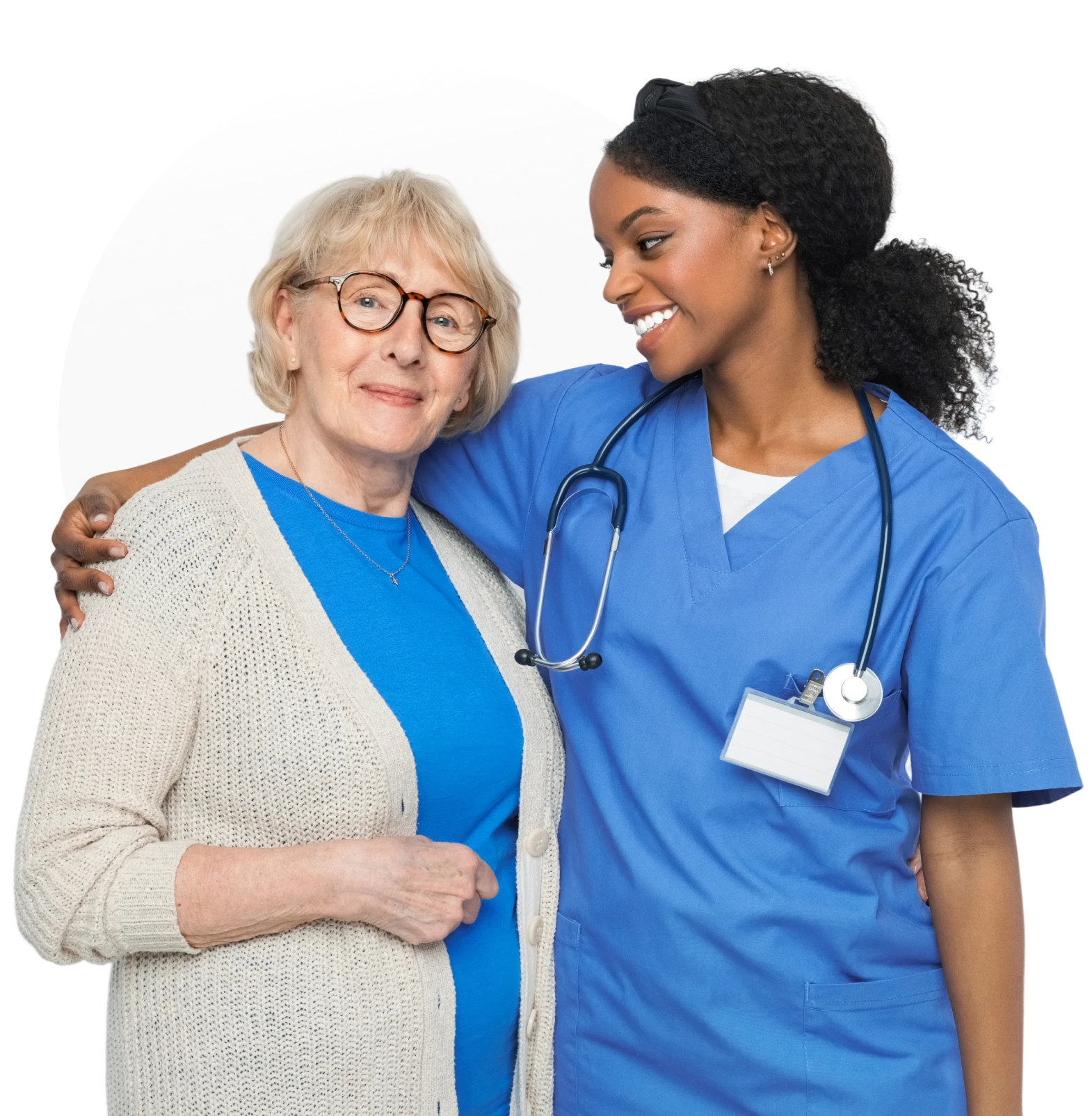 Nurse embracing elderly woman