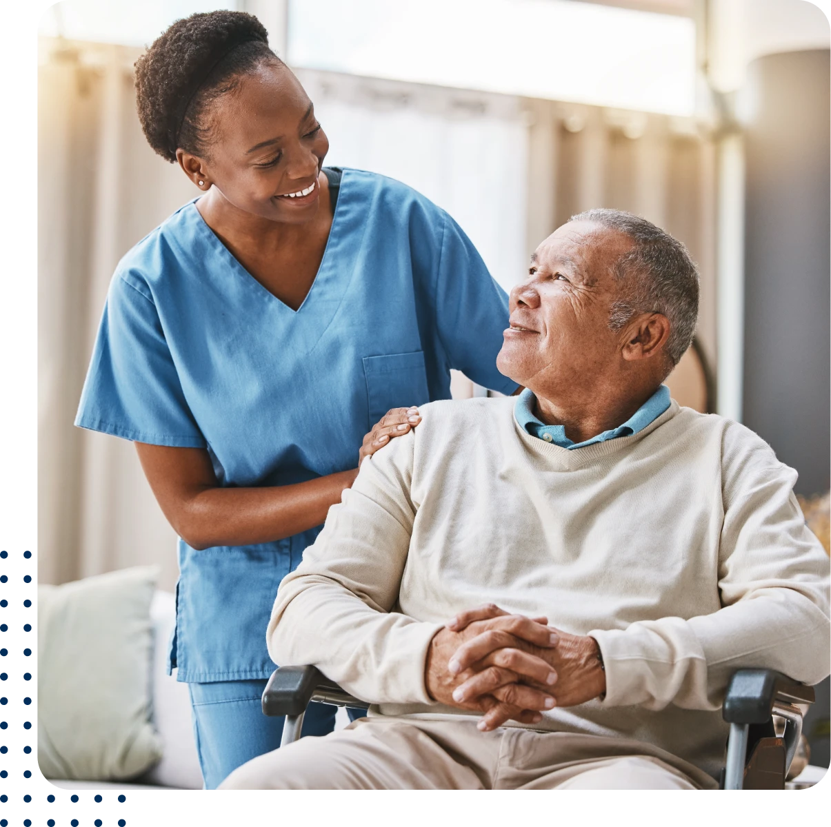 Caregiver smiling at senior patient