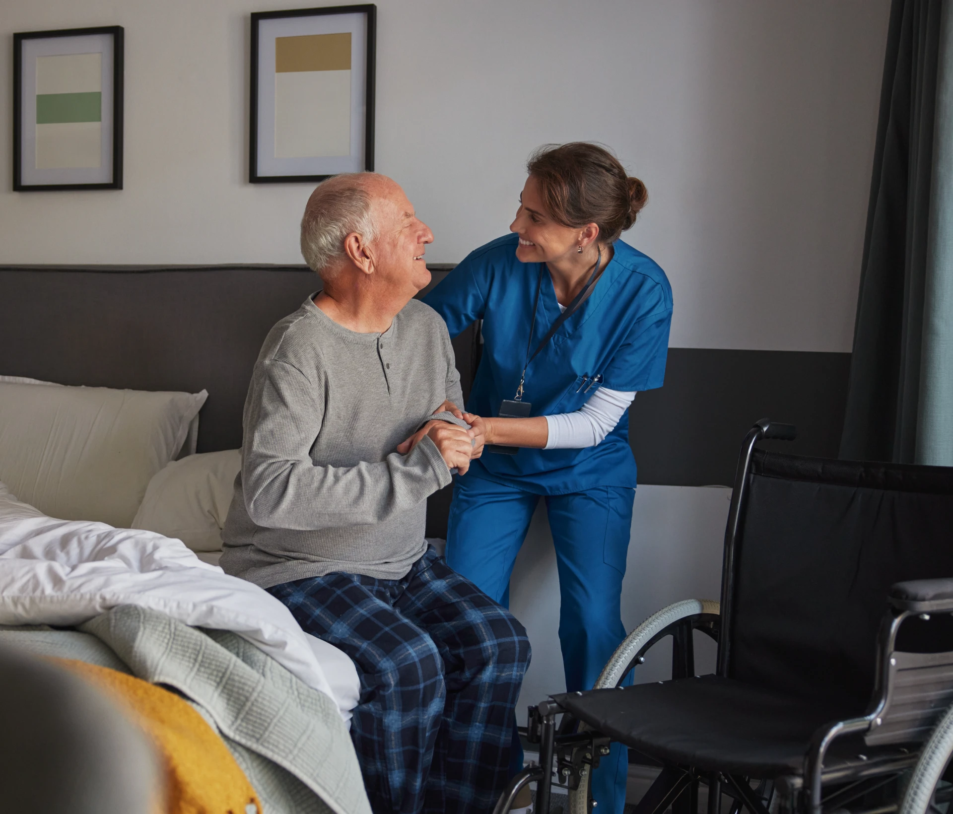 Caregiver supporting senior by wheelchair